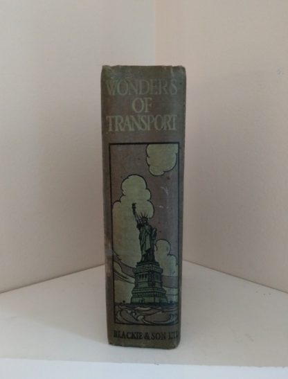 binding with the image of statue of Liberty, on an Antique Book Wonders of Transport, By Cryril Hall, Triumphs of Enterprise