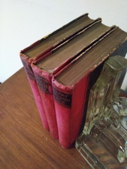 Head view of text block of 3 William H. Thackeray Works in The Pocket Edition, 1886-1887