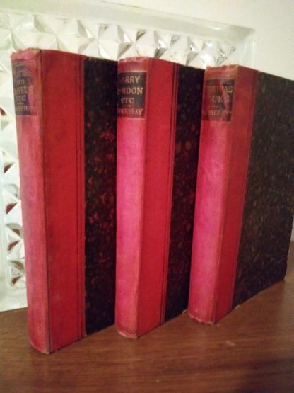 Spine view of 3 W.H. Thackeray Works in The Pocket edition, 1886-1887