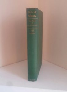 Spine view of a 1945 First Edition of Bolts of Melody by Emily Dickinson