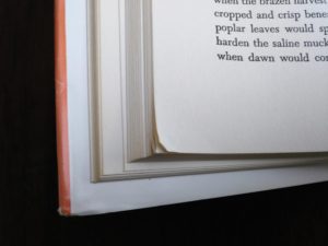 close up of bent pages in a copy of The Dog Who Wouldnt Be, 1957, 4th edition, by Farley Mowat