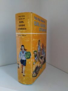 spine view of a copy of The Peal Book of Girl Guide Stories with three full length stories