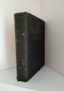spine view of a copy of Les Miserables illustrated by Mead Schaeffer published by Dodd Mead and Company