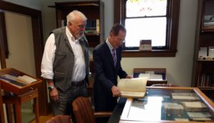 Ball State University President Geoffrey Mearns looks through Blackstones Magna Carta with Remnant Trust founder Brian Bex.
