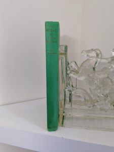 spine view on a 1963 copy of The House at Pooh Corner by A. A. Milne