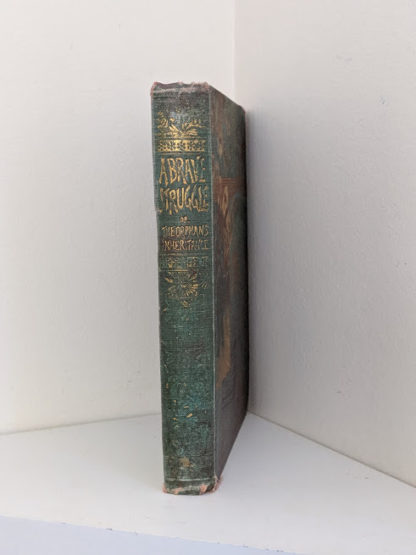 Spine view of a 1886 copy of A Brave Struggle by John S. Locke published by McLoughlin Brothers
