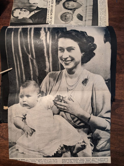 Princess Elizabeth holds in her arms baby prince Charles