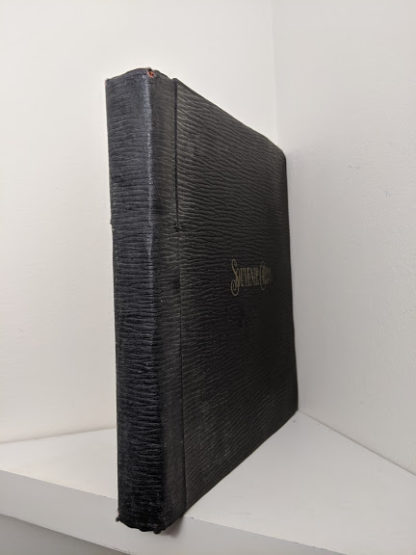 Spine view of a Vintage Souvenir Book Full of early article pictures of Queen Elizabeth