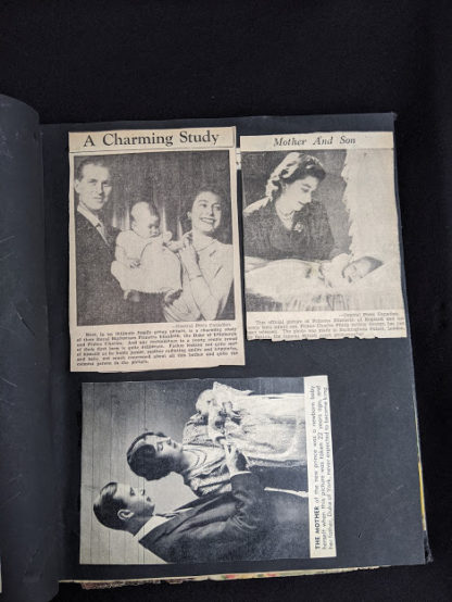 picture of Queen Elizabeth being held as a baby by her parents