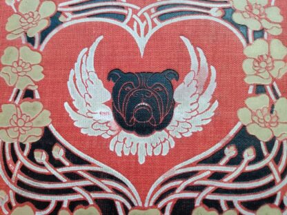 red cloth panel with beautiful cover design on a 1904 First Edition Copy of The Day of the Dog by George Barr McCutcheon