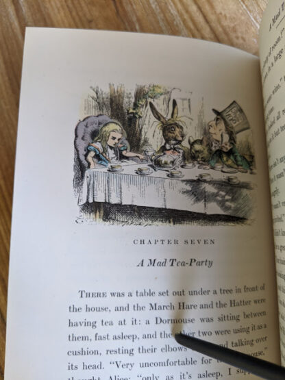 A Mad Tea Party - Colour illustration by John Tenniel inside a 1946 Alice’s Adventures in Wonderland - Two Volumes - by Lewis Carroll. Published by Random House, New York - Special Edition
