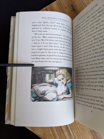Color illustration by John Tenniel inside a 1946 Alice’s Adventures in Wonderland - Two Volumes - by Lewis Carroll. Published by Random House, New York - Special Edition