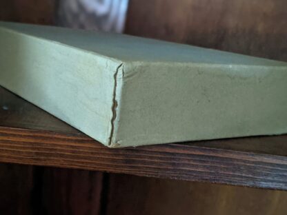 bottom edge of a slipcase for a 1946 Alice’s Adventures in Wonderland and Through The Looking-Glass - Two Volumes - by Lewis Carroll. Published by Random House, New York - Special Edition