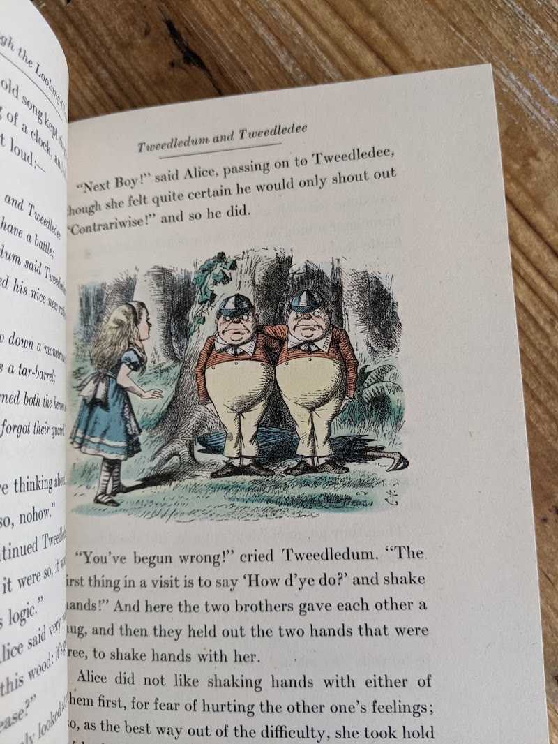 illustration of Tweedledum and Tweedledee by John Tenniel inside a 1946 Through The Looking-Glass - Two Volumes - by Lewis Carroll. Published by Random House, New York - Special Edition