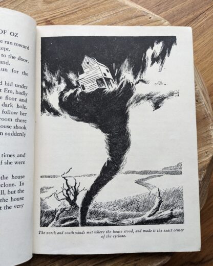 Full page illustration of the cyclone inside a 1944 copy of The New Wizard of Oz by L. Frank Baum - Illustrations by Evelyn Copelman