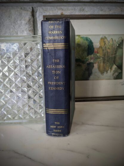 1964 REPORT OF THE WARREN COMMISSION - The Assassination of President Kennedy published by Bantam Books Inc. - The New York Times Company - binding view