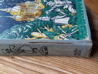 rip in cloth cover along lower spine ridge - 1932 The Land of Oz - illustrated John R. Neill - The Reilly & Lee Co