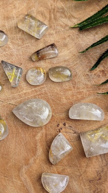 up close picture of a Hand Carved Rune Set on 340 Ct of Natural Golden Rutilated Quartz