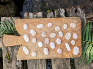 Reverse side view - Rune set hand carved on 1000 Ct of Rose Quartz