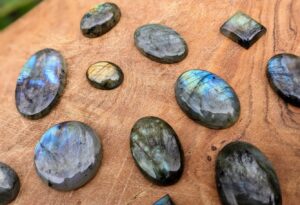 Reverse side view up close - Rune Set hand carved on 520 Ct Polished Rainbow Labradorite - Ash Tree Runes