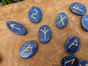 Rune set hand carved on 600 Ct Natural Blue Lapis with Gold Pyrite Spots - up close