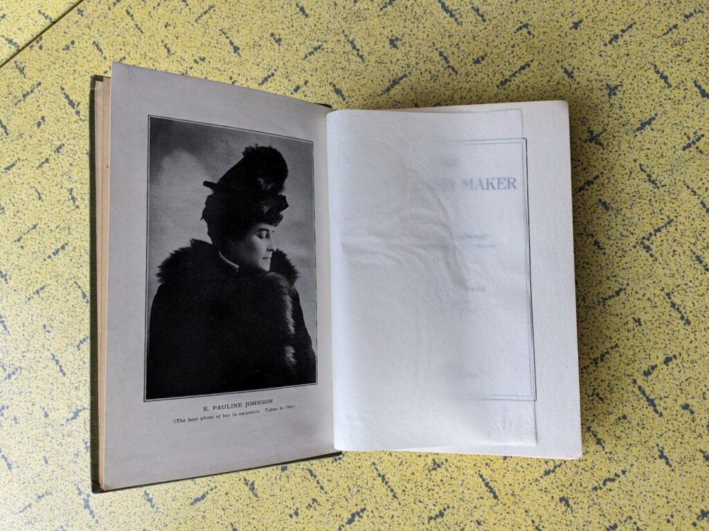 Photo of E. Pauline Johnson inside a 1913 First Edition copy of The Moccasin Maker by E. Pauline Johnson