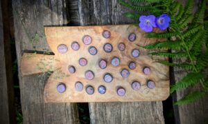 Hand Carved Elder Fulthark Rune Set on Star Ruby - Ash Tree Runes - flat side up with runes showing