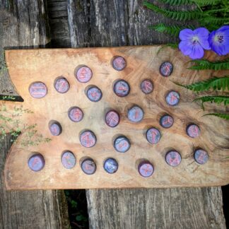 Hand Carved Elder Fulthark Rune Set on Star Ruby - Ash Tree Runes - flat side up with runes showing