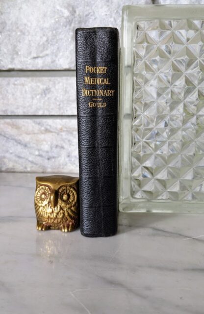 1928 Ninth Revised Edition — A Pocket Medical Dictionary by George M. Gould - Spine view