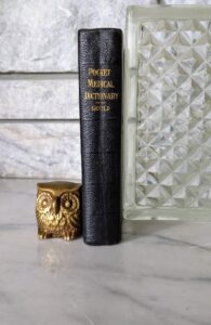 1928 Ninth Revised Edition — A Pocket Medical Dictionary by George M. Gould - Spine view