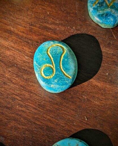 Close-Up of Leo Glyph - Hand-Carved Astrological Set on 1000 CT Natural Turquoise - Ash Tree Runes
