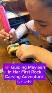 Guiding Mayleah with her first Rock Carving - Ash Tree Books and Runes